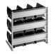 A white metal Carlisle 3-tier shelf with black bins on it.