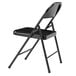 A National Public Seating black metal folding chair with a black seat.