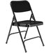 A black National Public Seating metal folding chair with a folding frame on a white background.