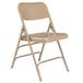 A National Public Seating beige metal folding chair.