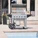 A Crown Verity mobile outdoor grill on a cart.