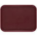 A dark red rectangular Cambro tray with a non-skid surface.