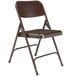 A brown National Public Seating metal folding chair.