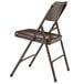 A brown National Public Seating metal folding chair.