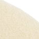 A close-up of a beige Scrubble burnishing floor pad with a white surface.