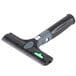 An Unger ErgoTec Ninja black and green 2-in-1 glass scraper with a handle.