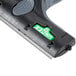 A close up of the Unger ErgoTec Ninja 6" black and green window scraper.