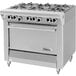 A large stainless steel Garland gas range with six burners and an oven.