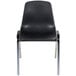 A black plastic National Public Seating stacking chair with chrome legs.