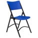 A National Public Seating blue folding chair with black frame.