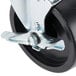 A Master-Bilt swivel stem caster with a black wheel and metal stem.