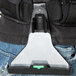 A person wearing an Unger ErgoTec Ninja scraper holster on a belt.