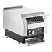 A large silver and black Hatco Conveyor Toaster with a metal rack on top.