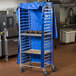 A Regency blue vinyl cover on a bun pan rack.