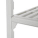 A white plastic Cambro Camshelving Premium unit with vented shelves.