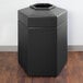 A black hexagonal PolyTec waste container with an open top.
