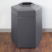 A gray hexagonal Commercial Zone waste container with an open top.