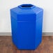A blue hexagonal PolyTec trash can with an open top.