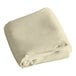 A folded ivory rectangular cloth table cover.