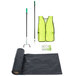 A black plastic bag with a roll of yellow Unger trash bags and a yellow vest.