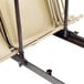 A metal frame with pipes for converting a National Public Seating dolly.