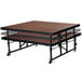 A brown National Public Seating Transfix portable stage with black metal legs.