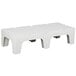 A white plastic Cambro bow tie dunnage rack with solid top.