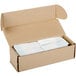 A white cardboard box with white napkin bands inside.