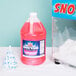 A large jug of pink Carnival King Pink Lemonade Snow Cone Syrup.