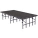 A National Public Seating portable stage with a metal frame on a table.