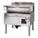 A large stainless steel electric tilt skillet with a 40-gallon capacity, open base, and control knob, designed for commercial kitchen use.