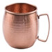 A Clipper Mill hammered copper Moscow Mule mug with a handle.