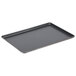 A black Vollrath Wear-Ever bun/sheet pan with a thin metal edge.