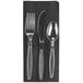 A black napkin with Visions clear plastic silverware on it.