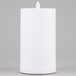 A white rectangular Sterno Mirage flameless LED candle on a gray surface.