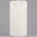 A cream colored Sterno Mirage flameless LED candle.