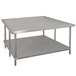 An Advance Tabco stainless steel work table with a galvanized undershelf.