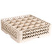 A beige Vollrath Traex glass rack with compartments.