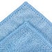 A close up of a blue Unger SmartColor microfiber cleaning cloth.