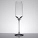 A close up of a clear Stolzle flute wine glass.