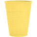A close up of a yellow Creative Converting plastic cup.