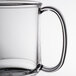 A close up of a clear plastic GET Tritan mug with a handle.