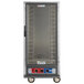 A large metal Metro C5 proofing cabinet with a clear door and wheels.