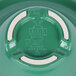 A close-up of a green bowl with a white rim.