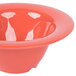 A close-up of a red melamine bowl with a wide rim.