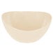 A beige round melamine bowl with a curved edge.