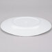 A white oval melamine platter with a circular rim.