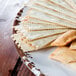 A Tuscan Flare melamine platter with crackers on it.