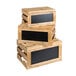 A stack of wooden crates with chalkboard panels on top.