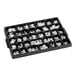 A black tray with white letters and numbers.